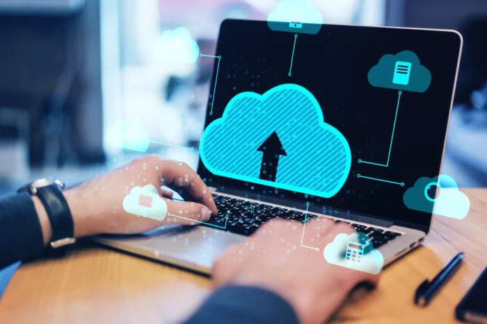 Close Up Of Male Hands Using Laptop At Desktop With Abstract Digital Cloud On Blurry Background - Medisoft Backup and Restore Problems: Causes, Solutions, and Best Practices - Computer Mate